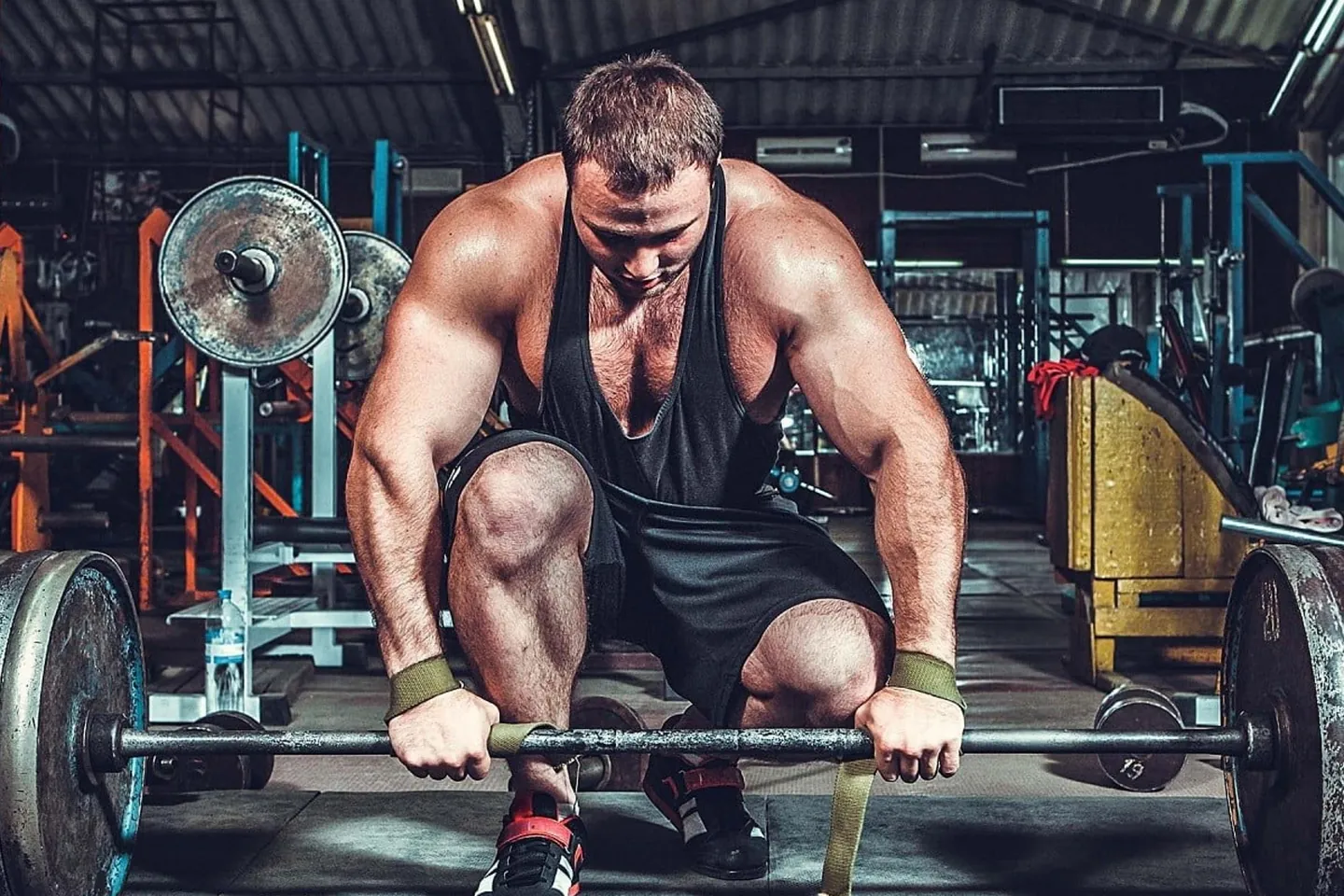 A heavy barbell deadlift with large plates