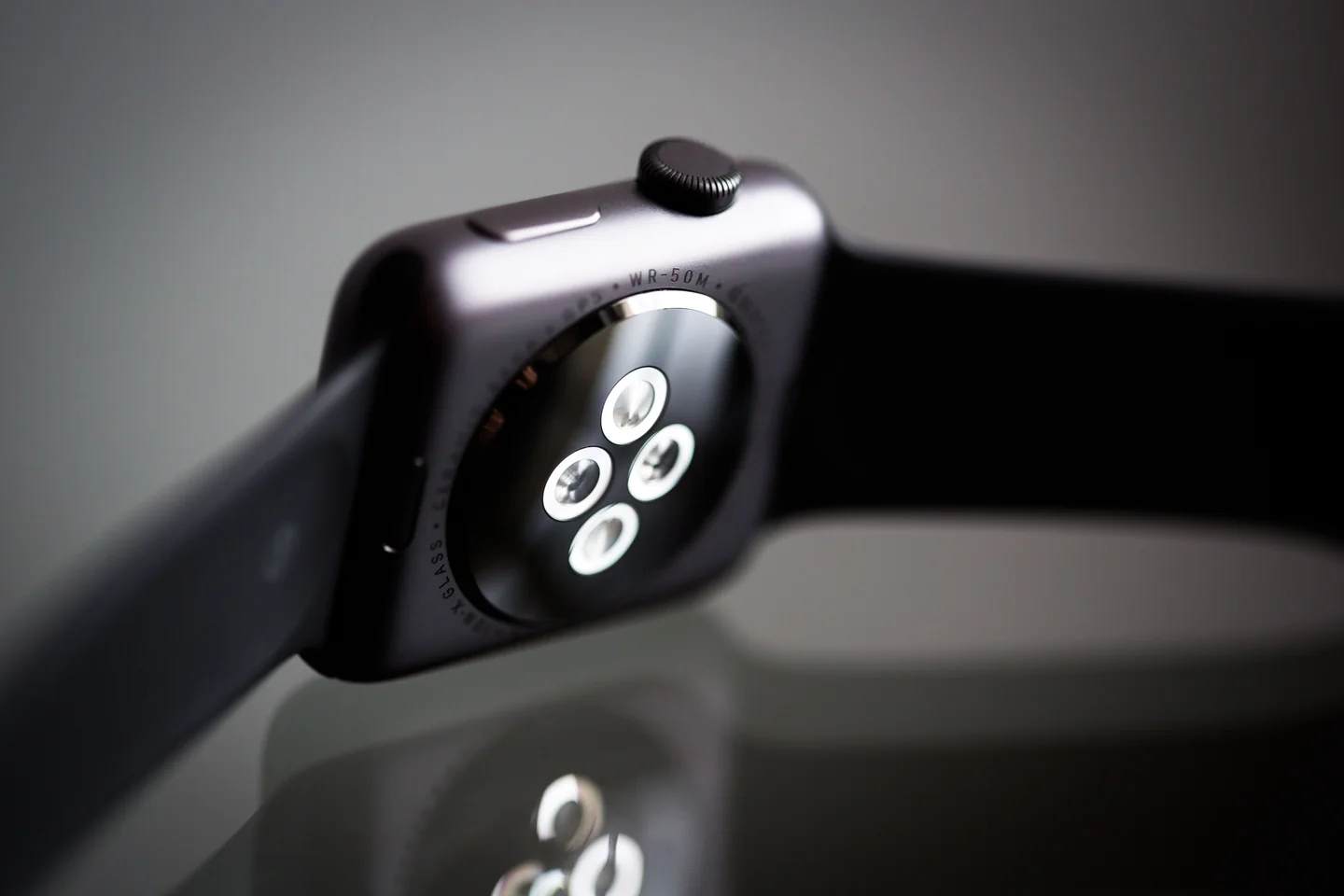 Close-up of the back of an Apple Watch showing the sensor array