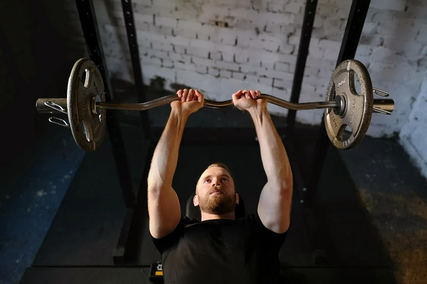 A barbell overhead press on a push day